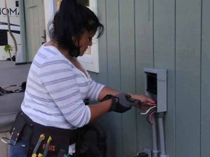 Licensed electrician wiring an exterior subpanel in Farmville