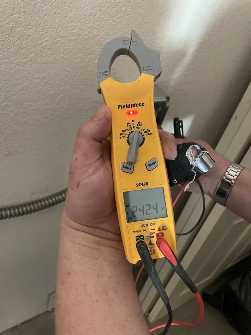 Voltage testing with clamp meter during Outlet Installation in Farmville